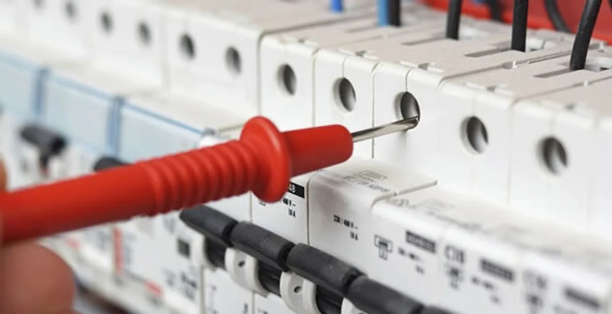 Electrical contractor testing circuit breakers during electrical repair in Wyoming, MI