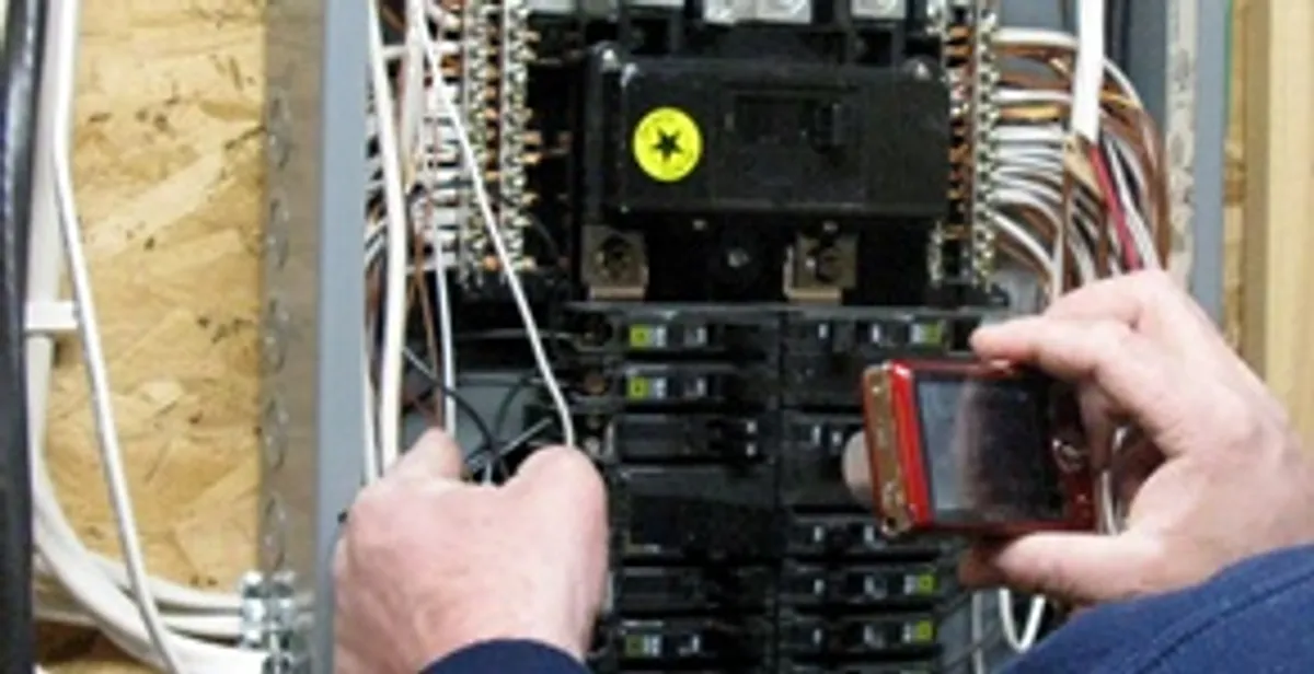 Home electrical inspection of circuit breaker panel by licensed electrician in Grand Rapids, MI
