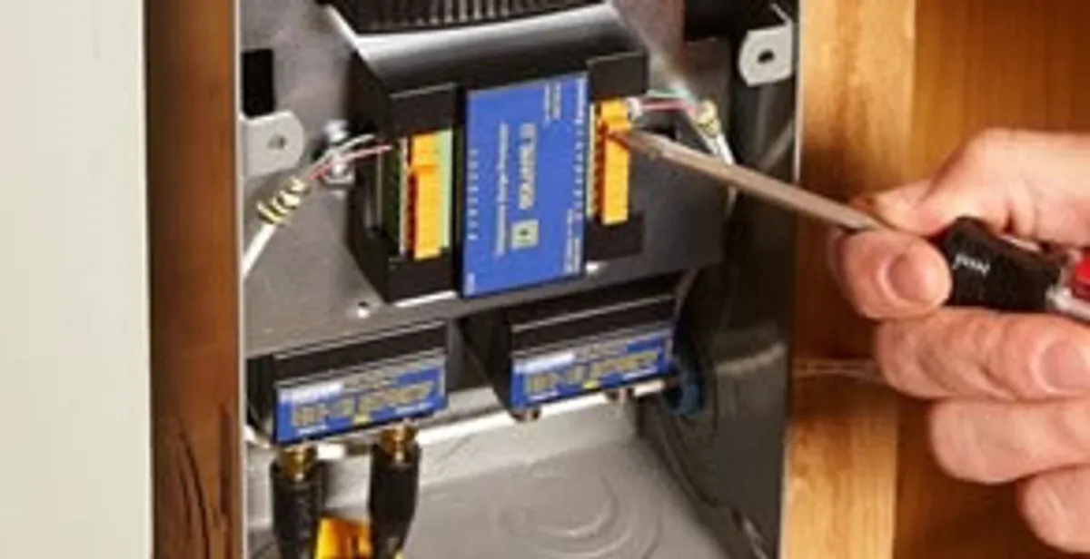 Whole home surge protection device being installed by a licensed electrician to protect electrical systems in Grand Rapids, MI